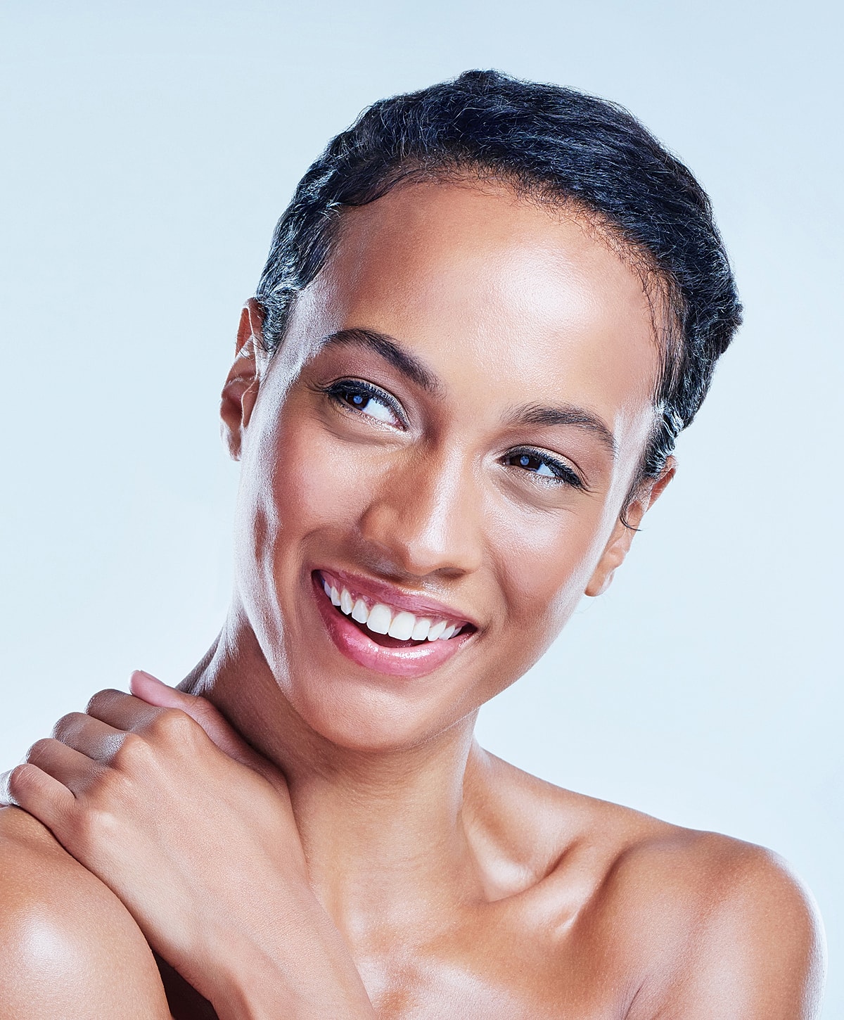 Smiling Lafayette chemical peel model with short hair and flawless skin.